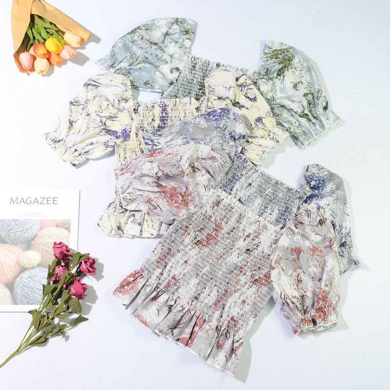 Floral-print smocked tops with puff sleeves and ruffled hems in several colors